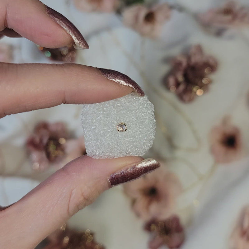 White gold stud earring featuring a 2.5mm rose cut diamond. Hand made and finished. Video of earring.