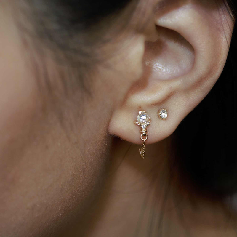 Rose gold rococo baroque inspired scroll work earring featuring 3.5mm round rosecut diamond and diamond accent. Handcrafted and finished. Double earing stack worn on ear.