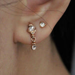 Yellow gold stud earring featuring a 2.5mm rose cut diamond. Hand made and finished. Worn on ear.