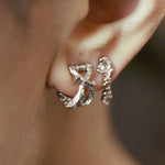 White gold rococo baroque inspired scroll work earring. Handcrafted and finished. Worn on ear